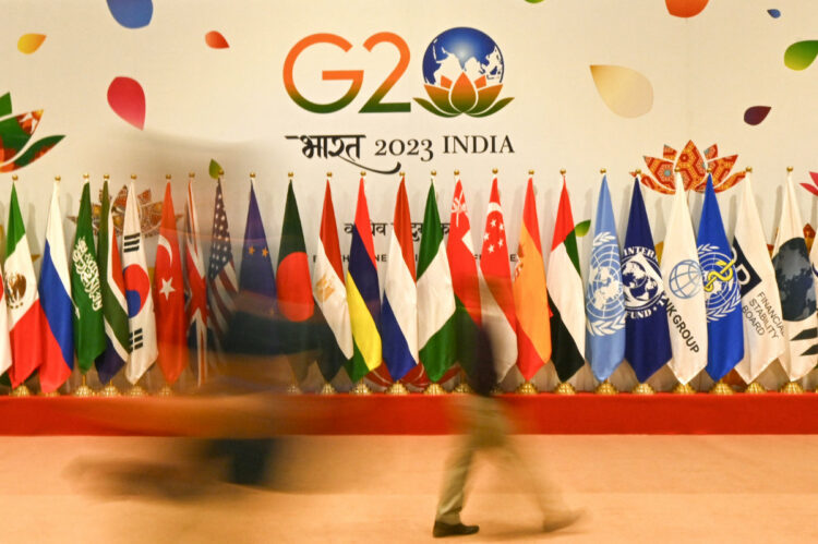 TOPSHOT - Flags of participating countries are pictured inside the International media centre at the G20 venue, days ahead of its commencement in New Delhi on September 7, 2023. (Photo by Money SHARMA / AFP)